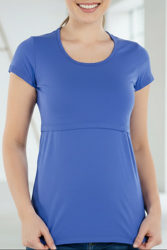Woman wearing a blue t-shirt in an indoor setting