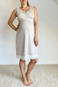 Woman wearing a beige dress with a white background